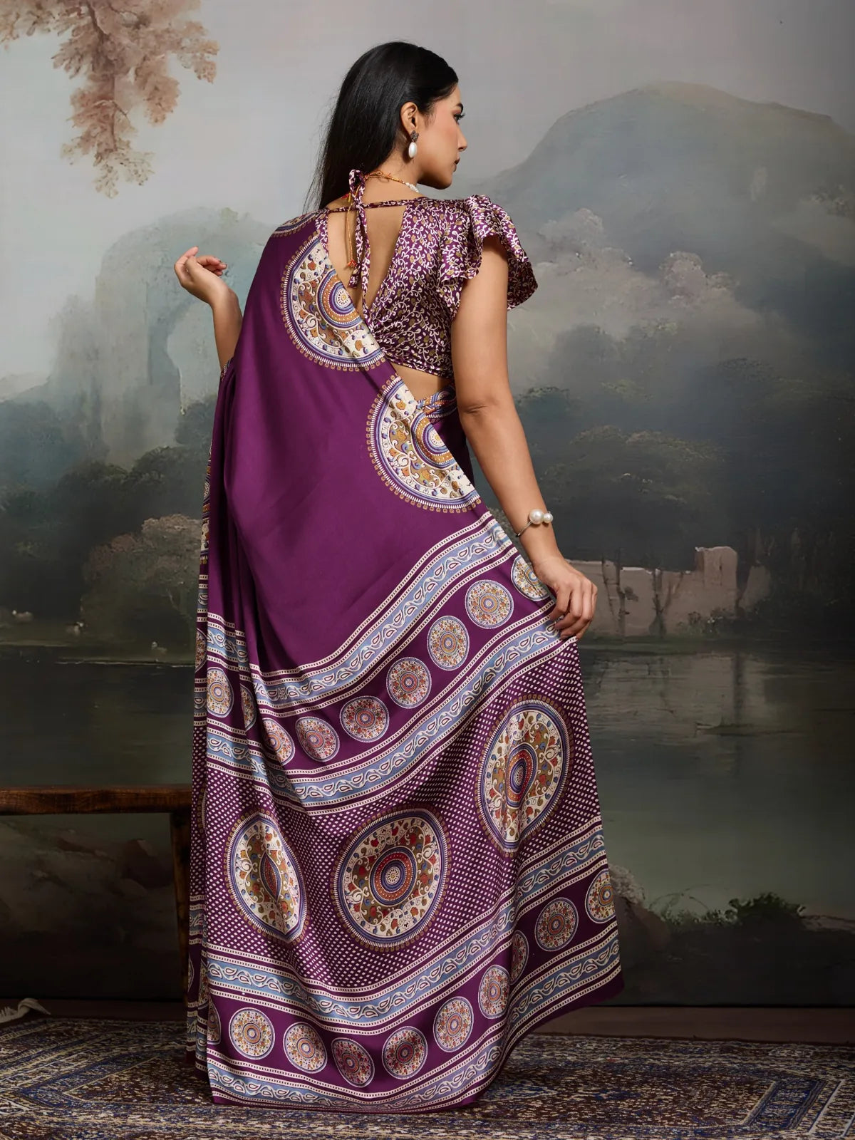 Back pose of Tarani Modal Satin purple Ajrakh print saree showcasing pallu and blouse