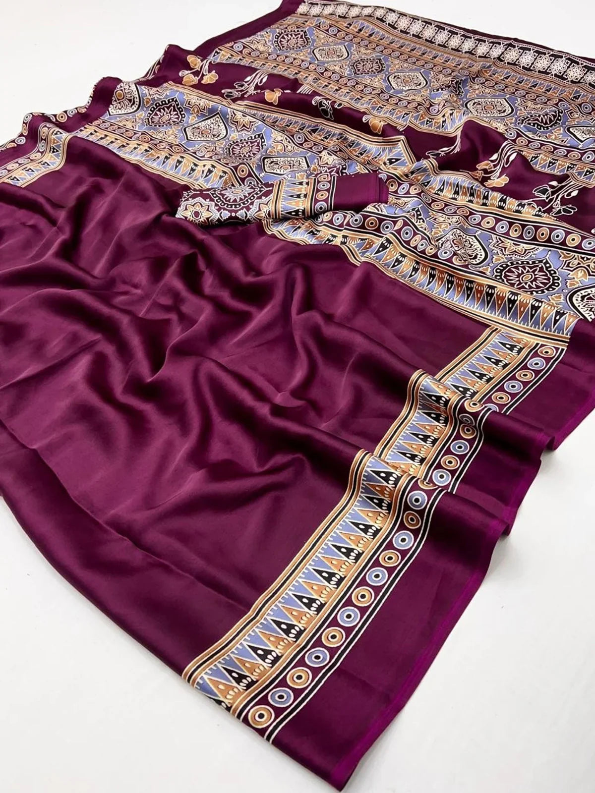 Closeup of Tarani purple modal satin saree with Ajrakh geometric print and soft texture