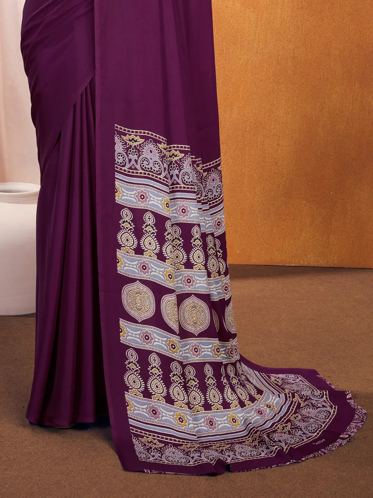 Tarani modal satin saree pallu view showing Ajrakh motifs and border in purple tone