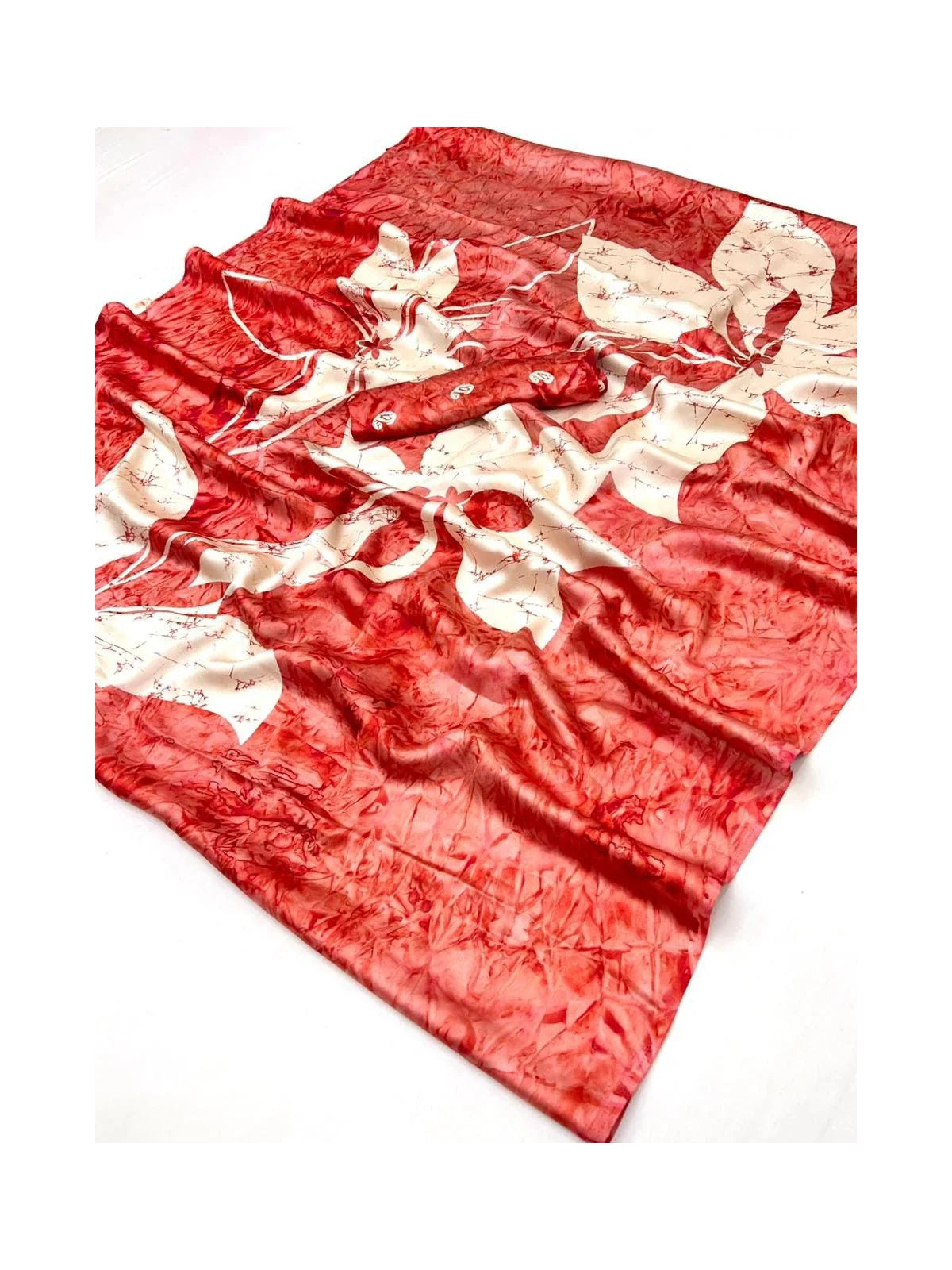Close-up view of Tarani red saree fabric and floral print in modal satin material