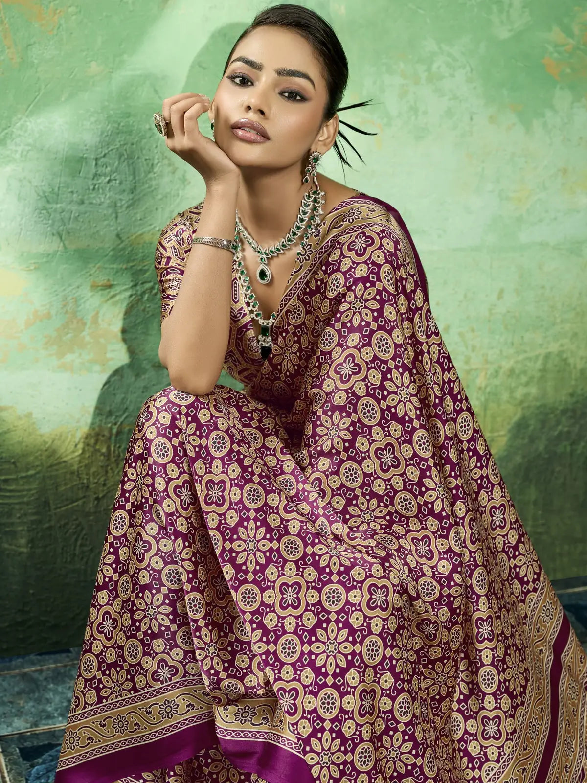 Tarani premium wine modal satin Ajrakh saree closeup showing soft drape and detailed print