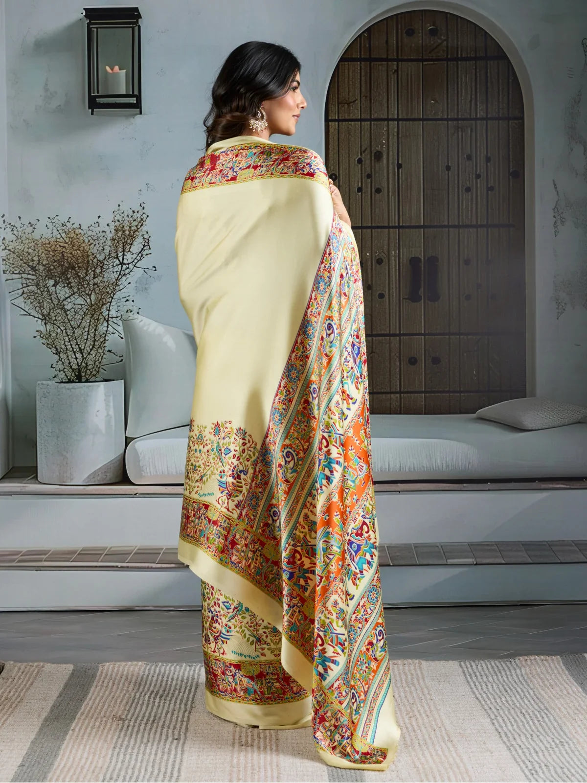 Back view of Tarani yellow Ajrakh print saree in modal satin fabric with ethnic design