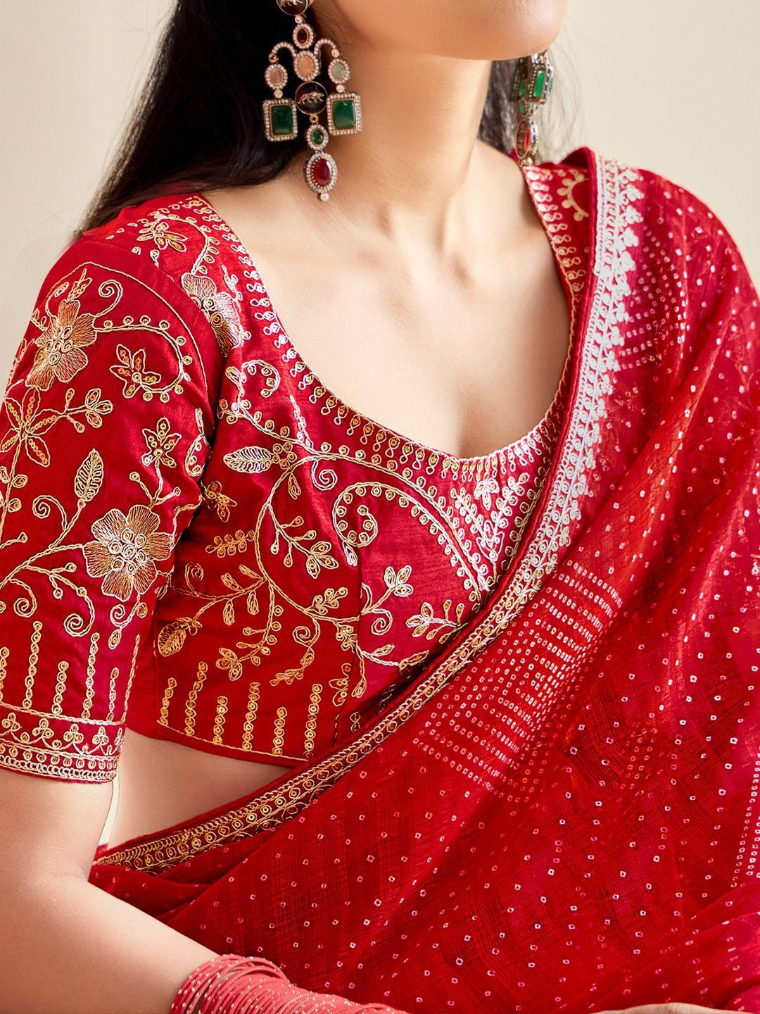 Tarani red embroidered blouse closeup with zari floral work and lace detailing from Tarani