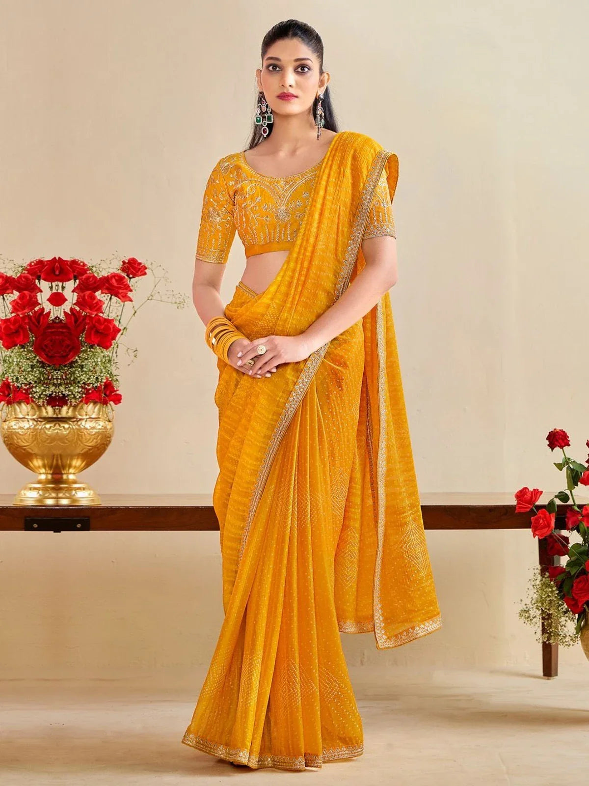 Tarani yellow moss chiffon silk saree with embroidered blouse for festive and party occasions