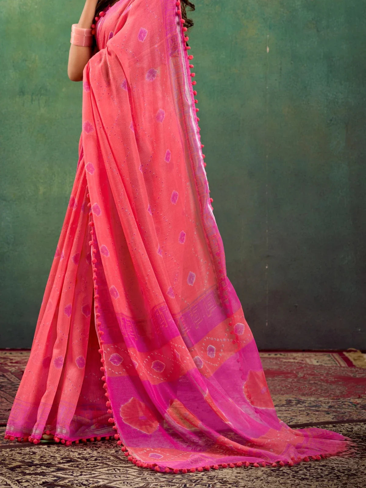 Tarani pink mul mul cotton saree side pose highlighting elegant design and texture