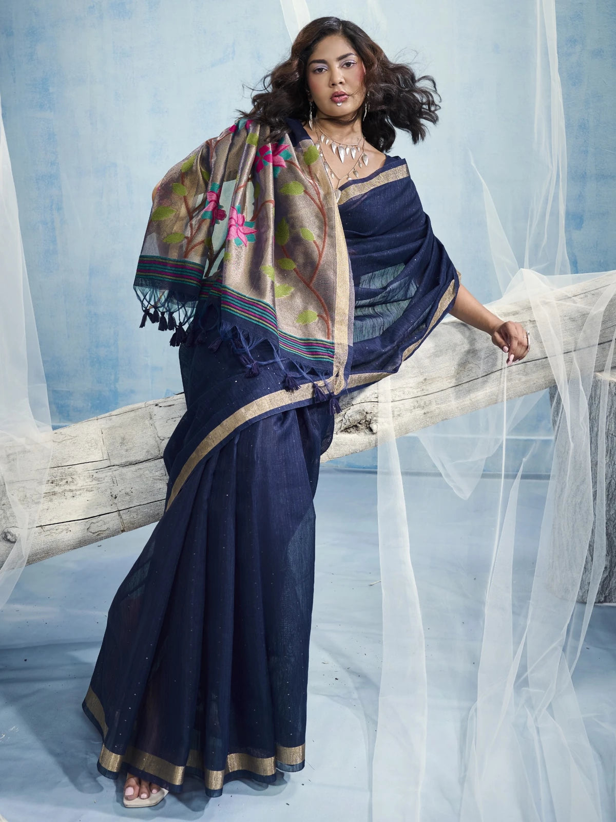 Tarani Aryavi navy blue saree pallu view with floral tissue pallu and tassel details