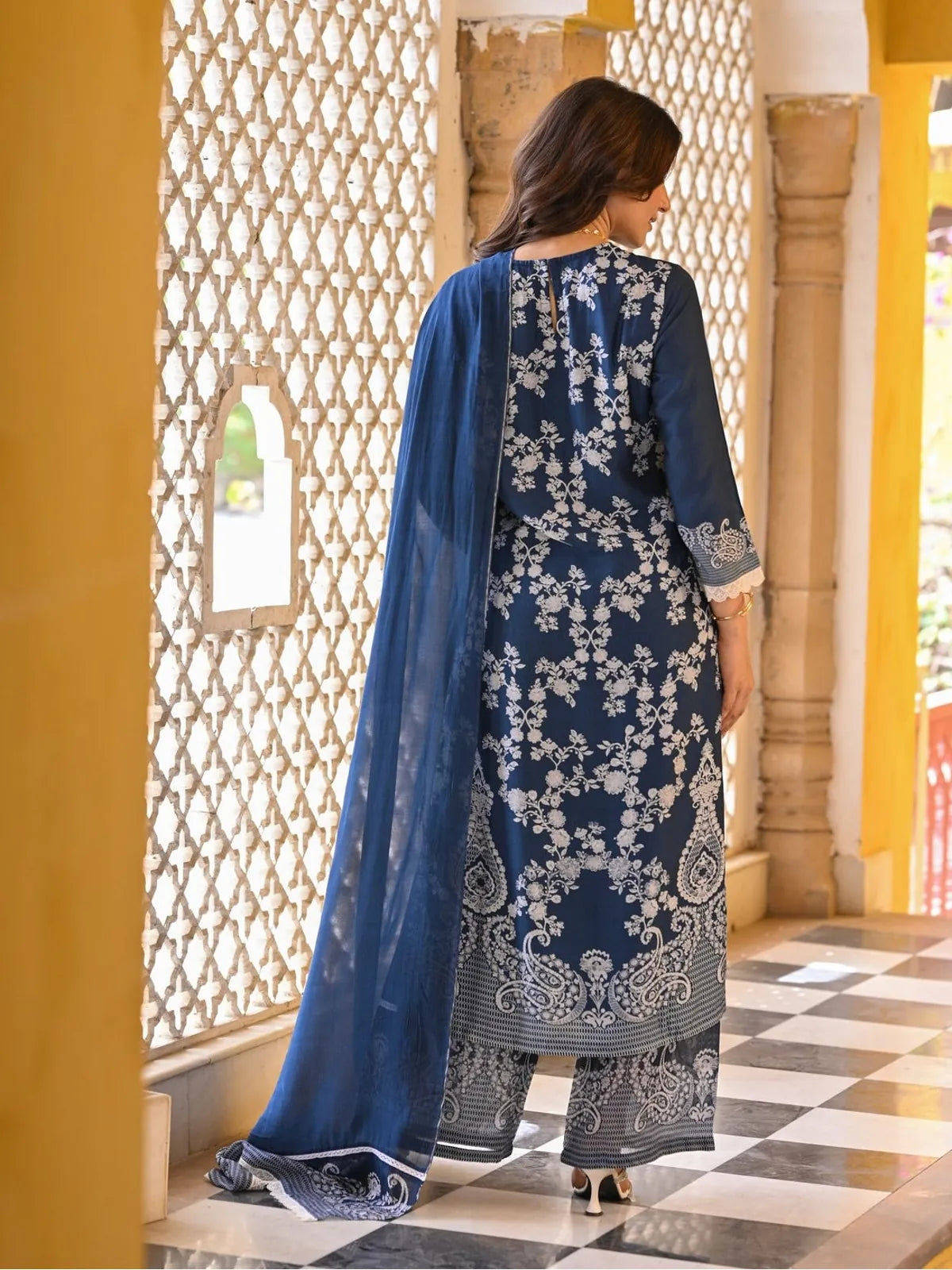 Tarani muslin embroidered navy dress back view with dupatta and detailed hem finish