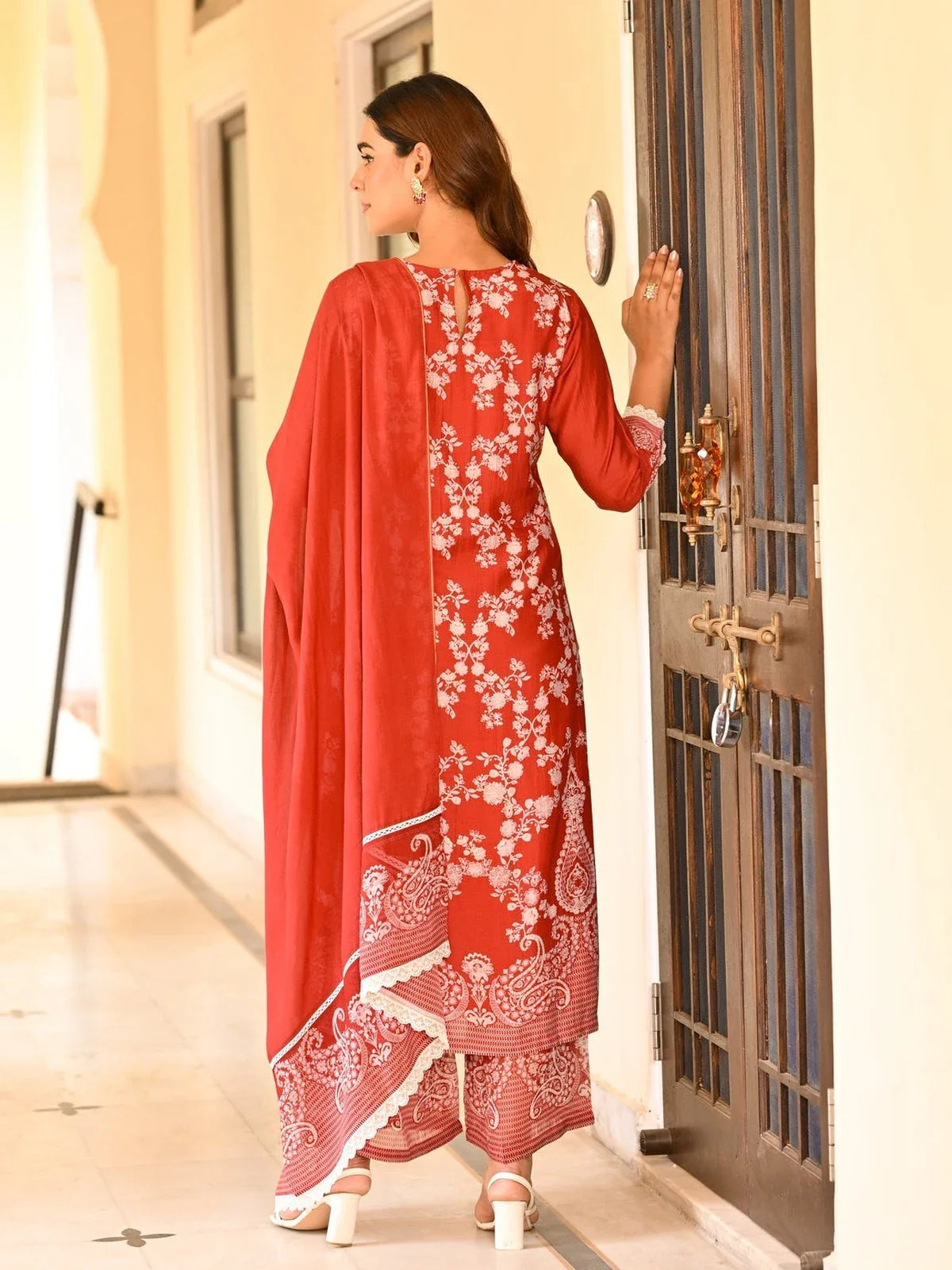 Back view of Tarani embroidered muslin dress with organza dupatta in festive red