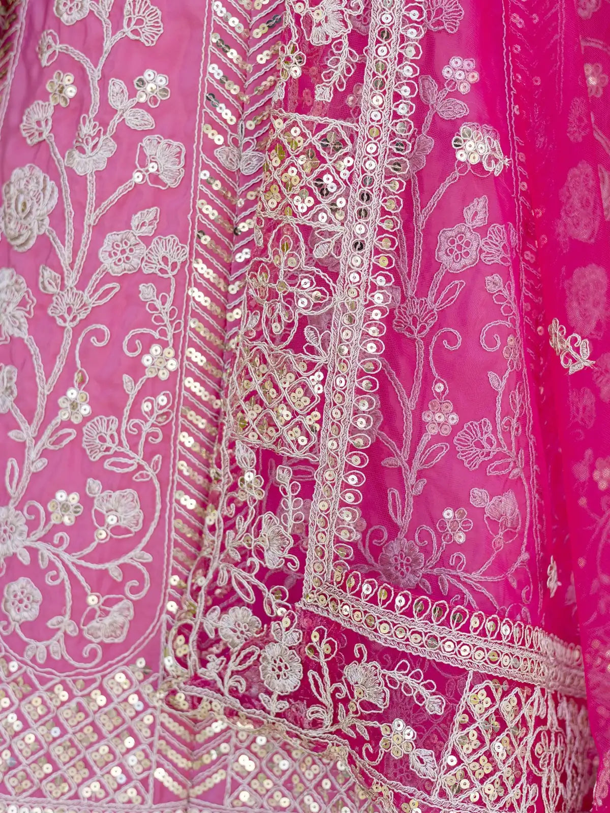Tarani lehenga closeup view showing intricate sequin and codding embroidery on pink crap silk