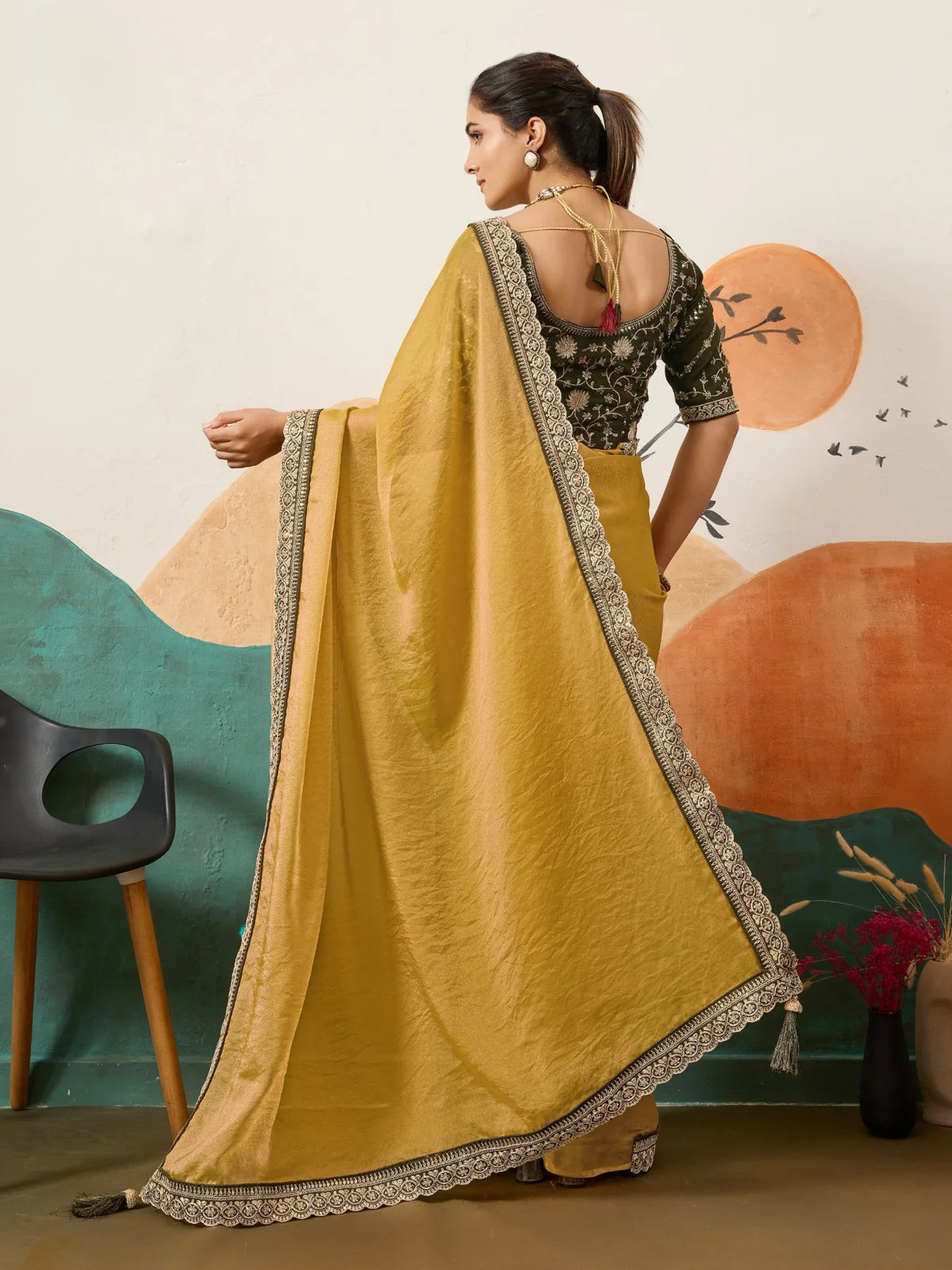 Tarani mustard saree back view with blouse back design and elegant pallu border