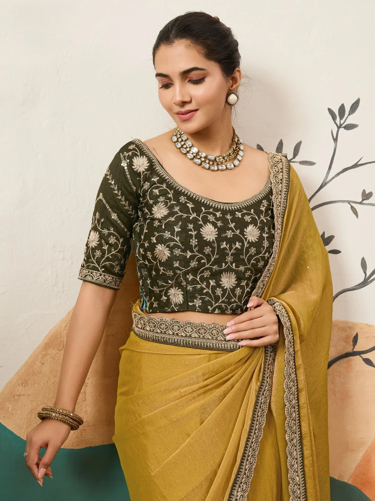 Tarani mustard party wear saree upper body view with coding work blouse and elegant border
