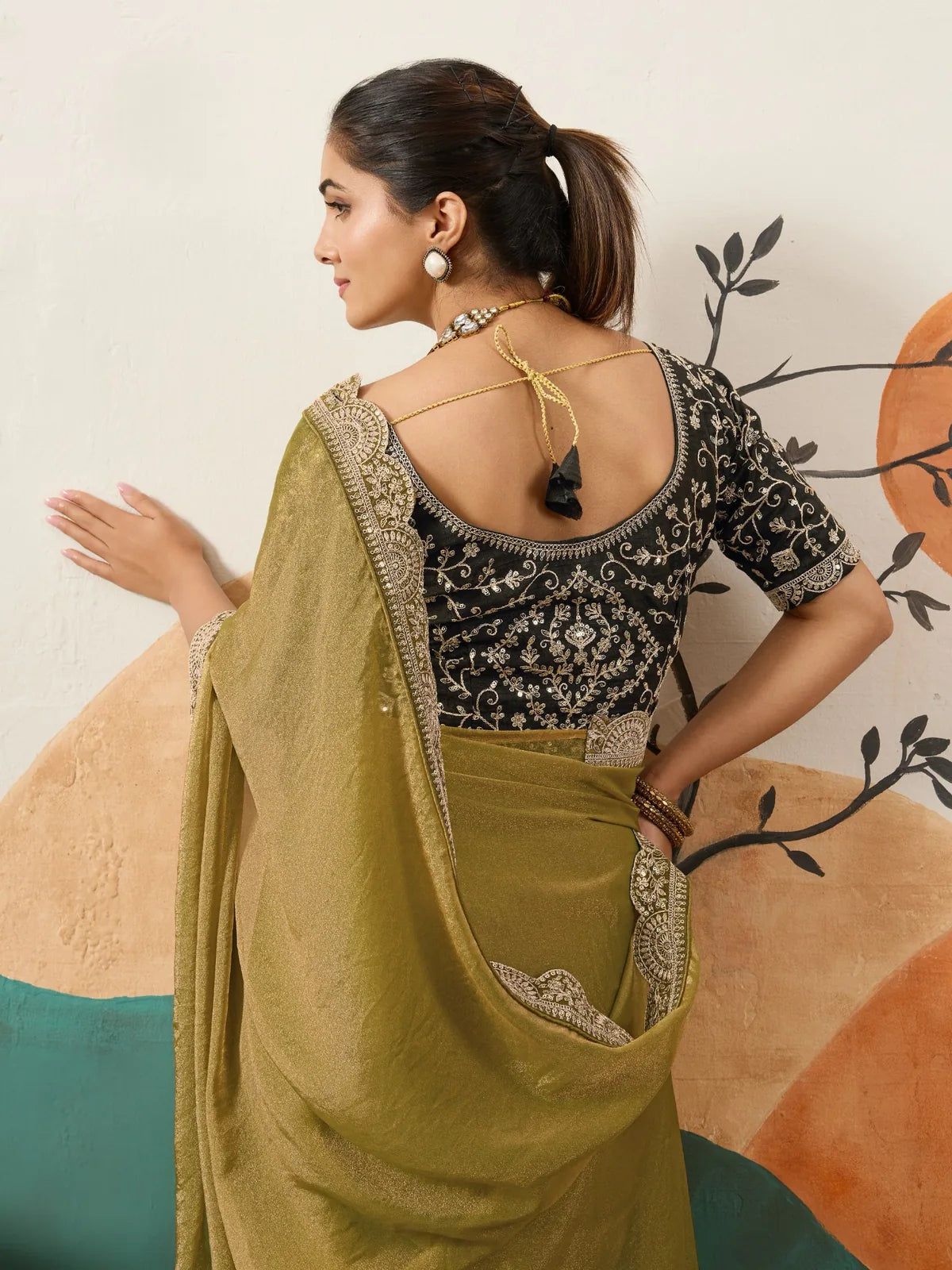 Tarani olive green saree with embroidered blouse back view for festive occasions