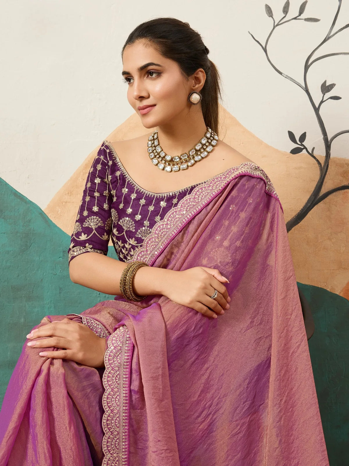 Tarani purple saree side view with coding work blouse and rich embroidered border