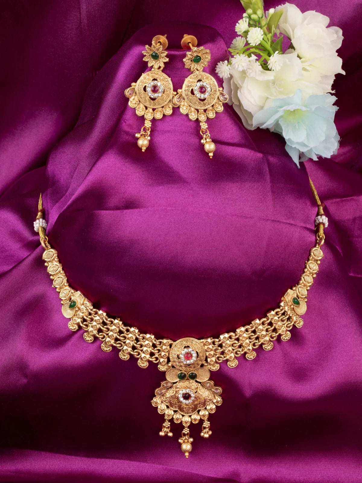 Tarani designer gold plated necklace set with antique work and matching earrings for weddings