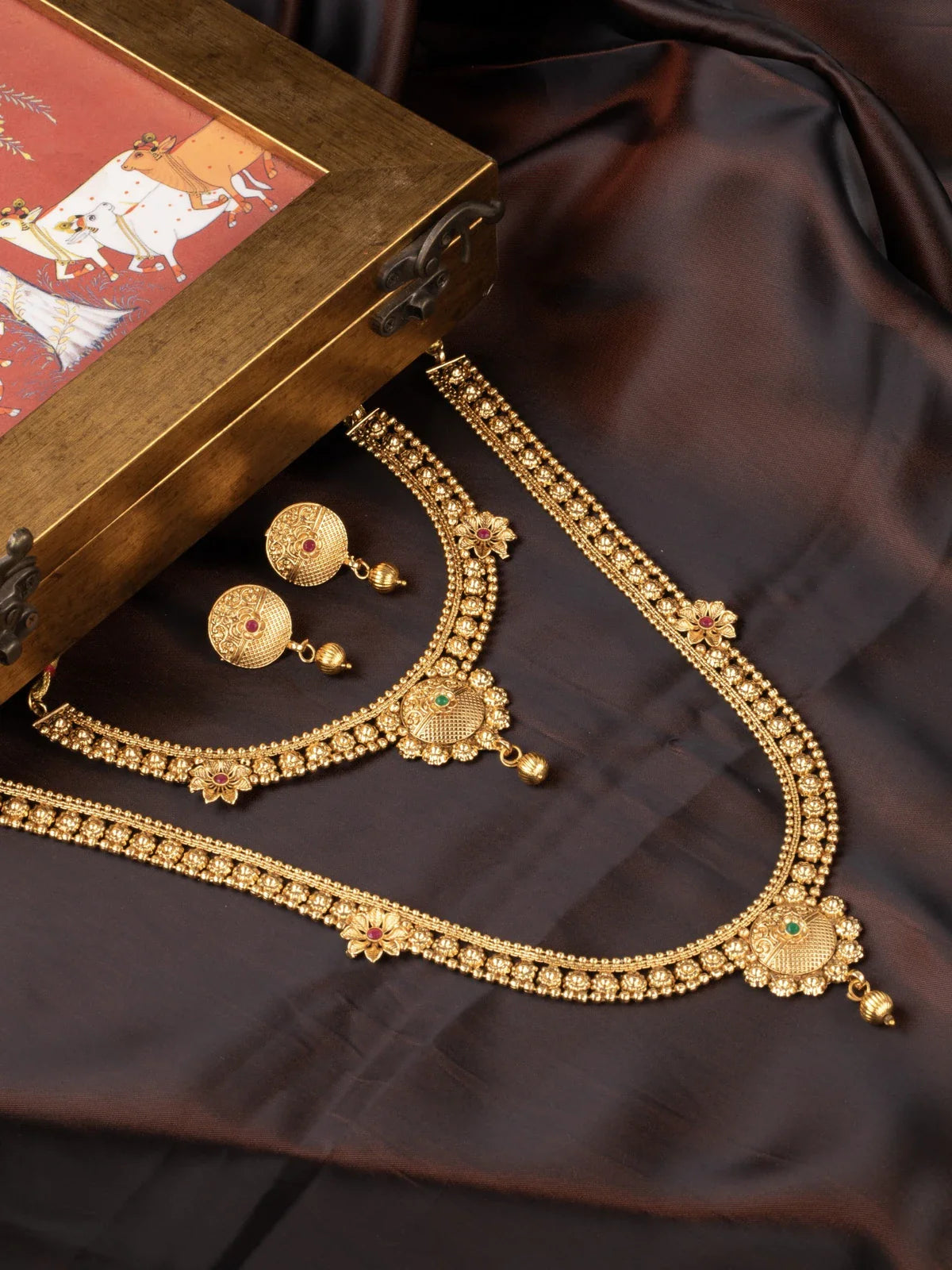 Tarani gold plated necklace set with antique finish and stone detailing for weddings