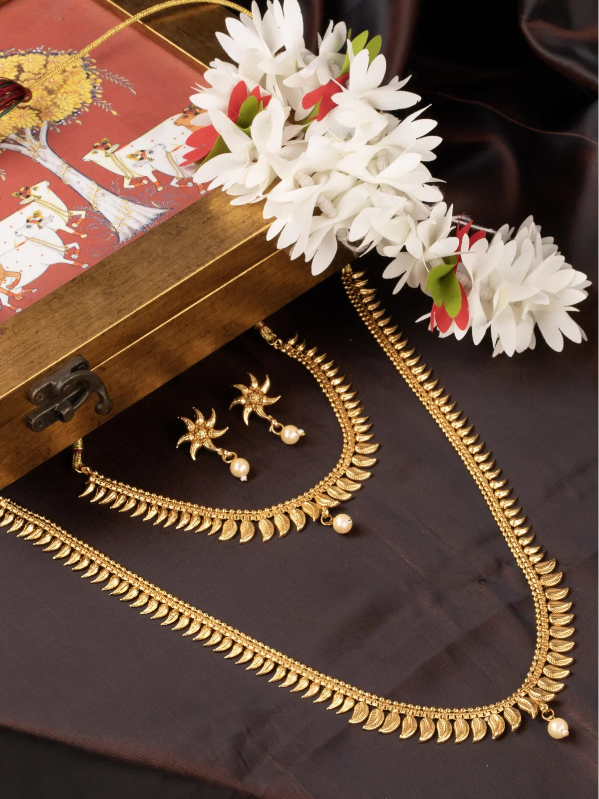 Tarani gold plated necklace set with pearl drops and matching earrings for weddings