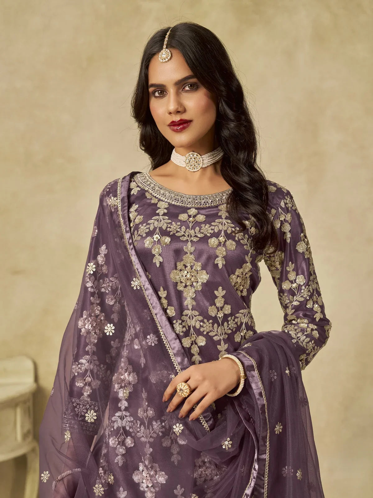Tarani purple net embroidered suit upper body view highlighting zari and sequins work