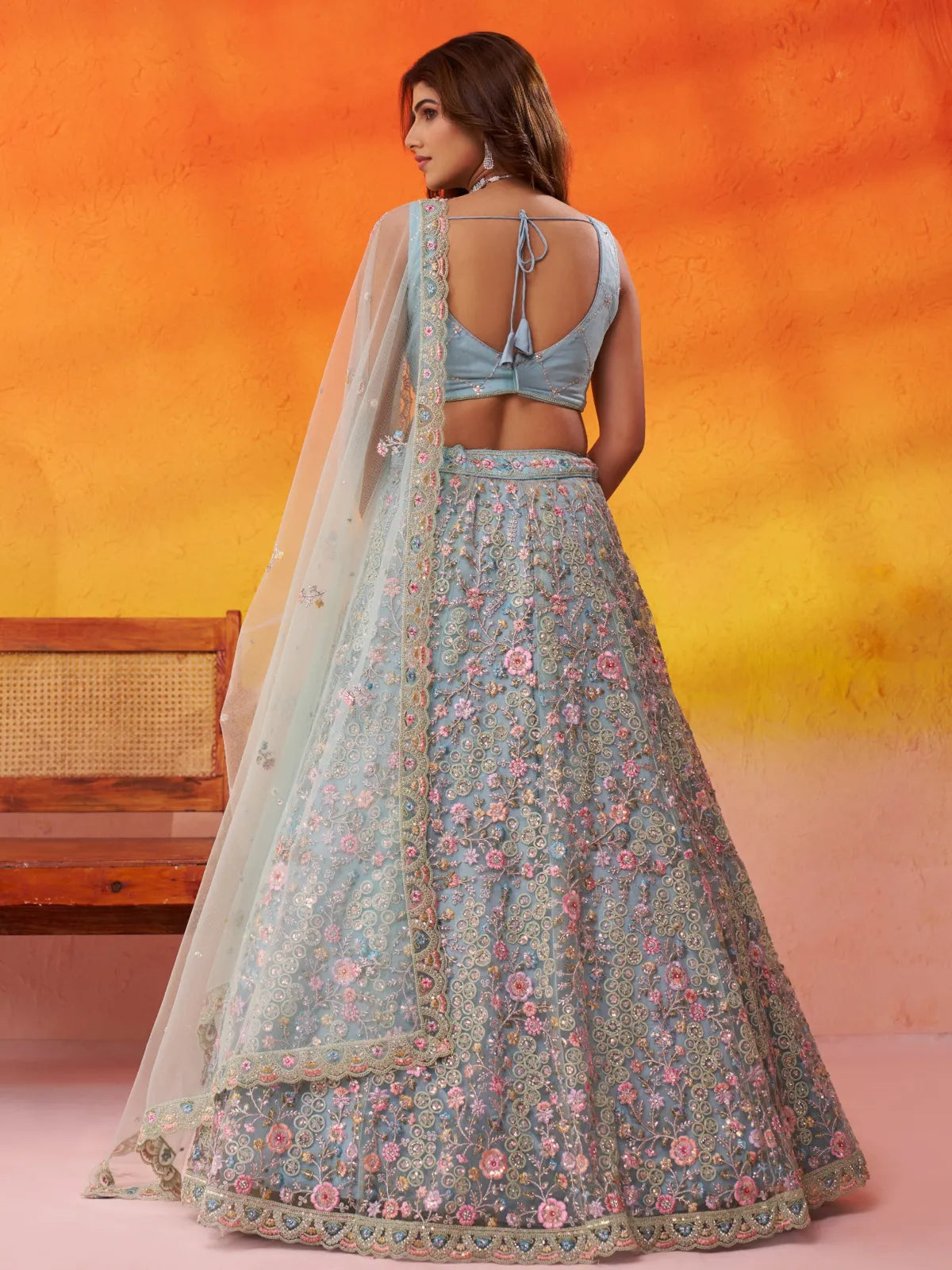 Tarani net lehenga in beige with stylish back tie blouse and full flair embroidery