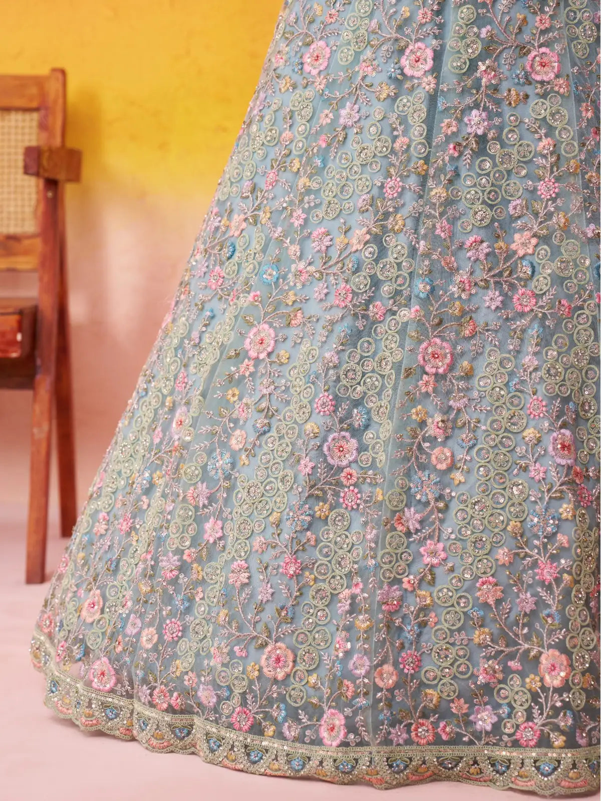 Tarani close-up view of net lehenga showcasing sequin, stone and thread floral embroidery work