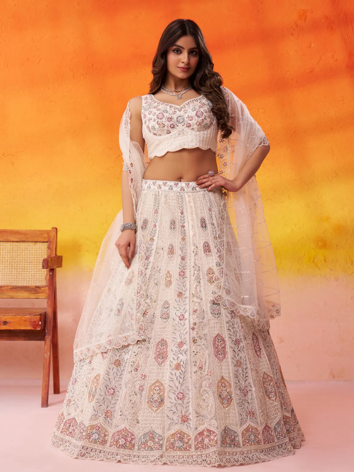 Tarani net beige lehenga with multicolor embroidery and full flair for wedding wear