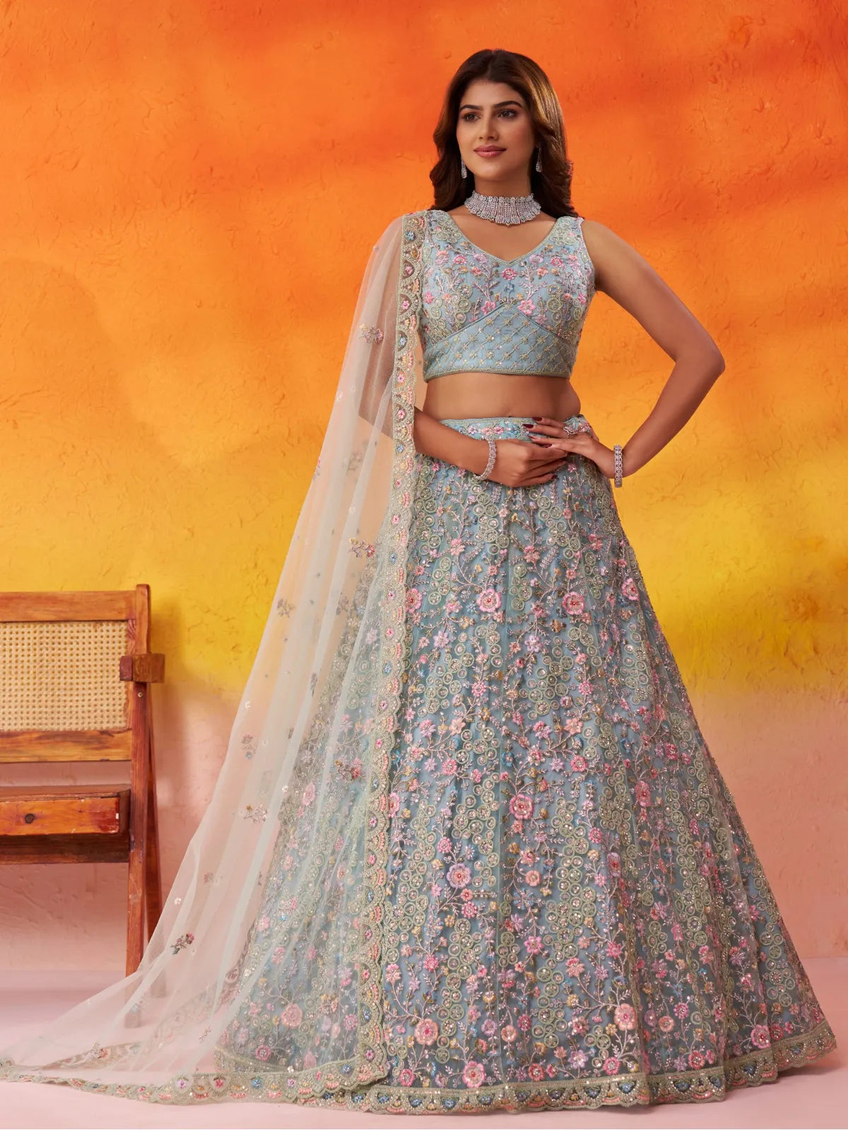Tarani beige net lehenga with heavy floral embroidery and full flare for festive occasions