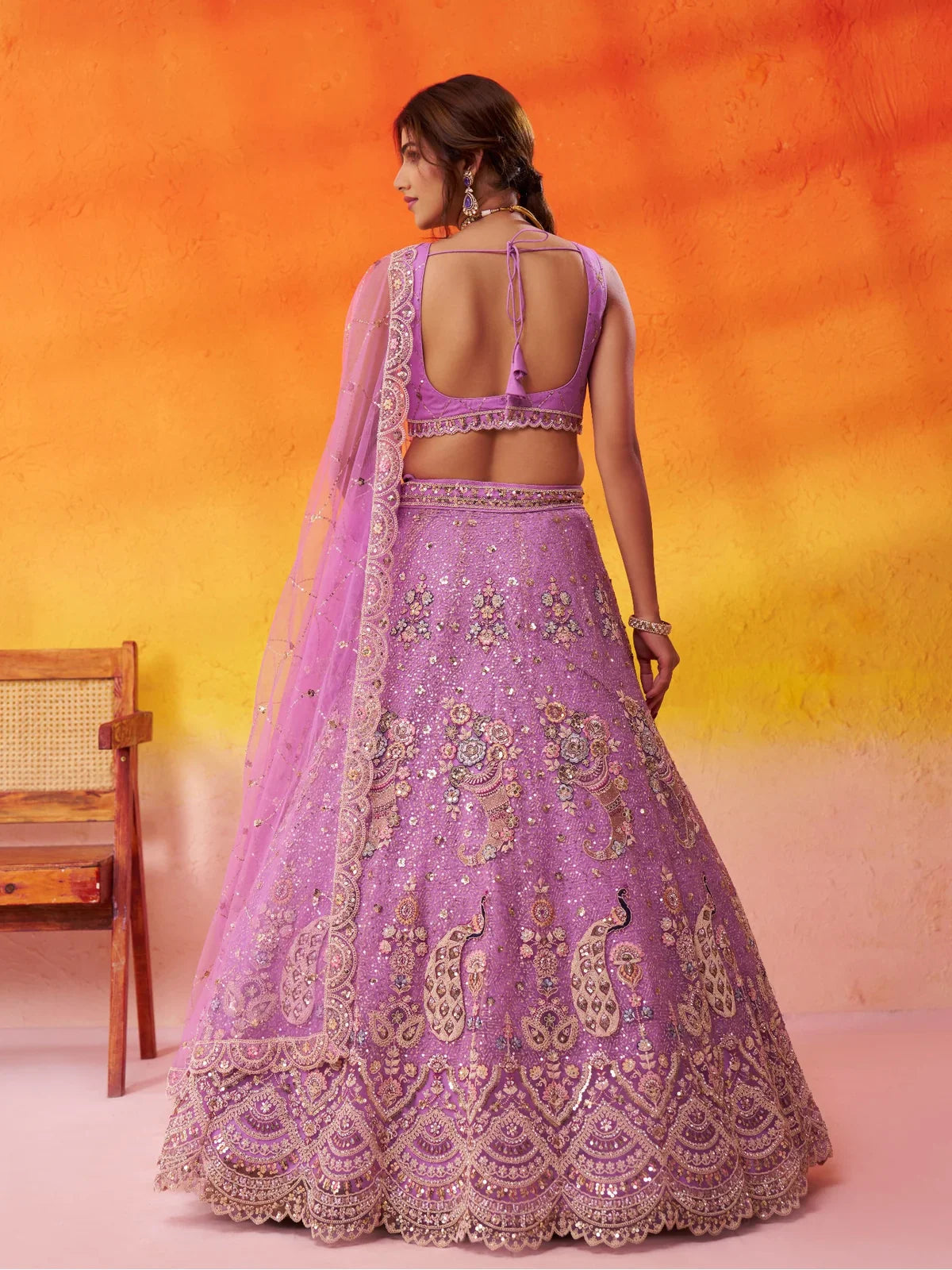 Tarani back view of lavender lehenga with dori blouse design and full flair look