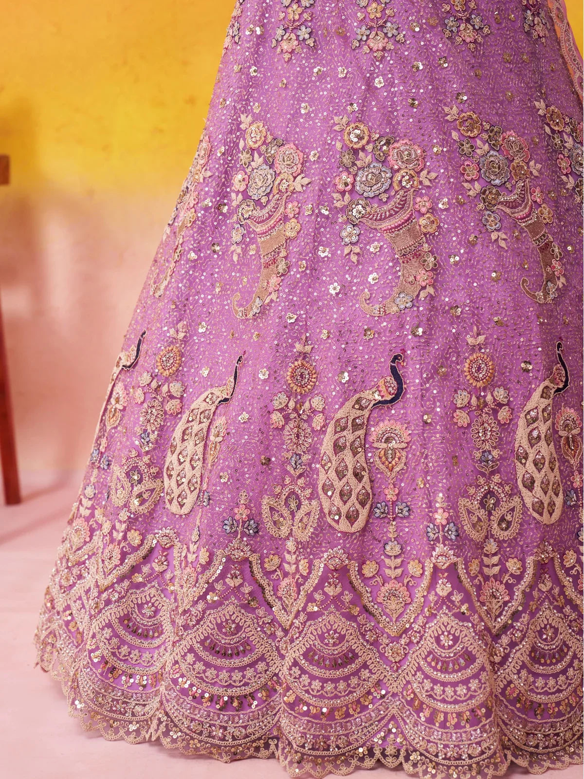Tarani closeup of lehenga base border embroidery with floral and peacock motifs