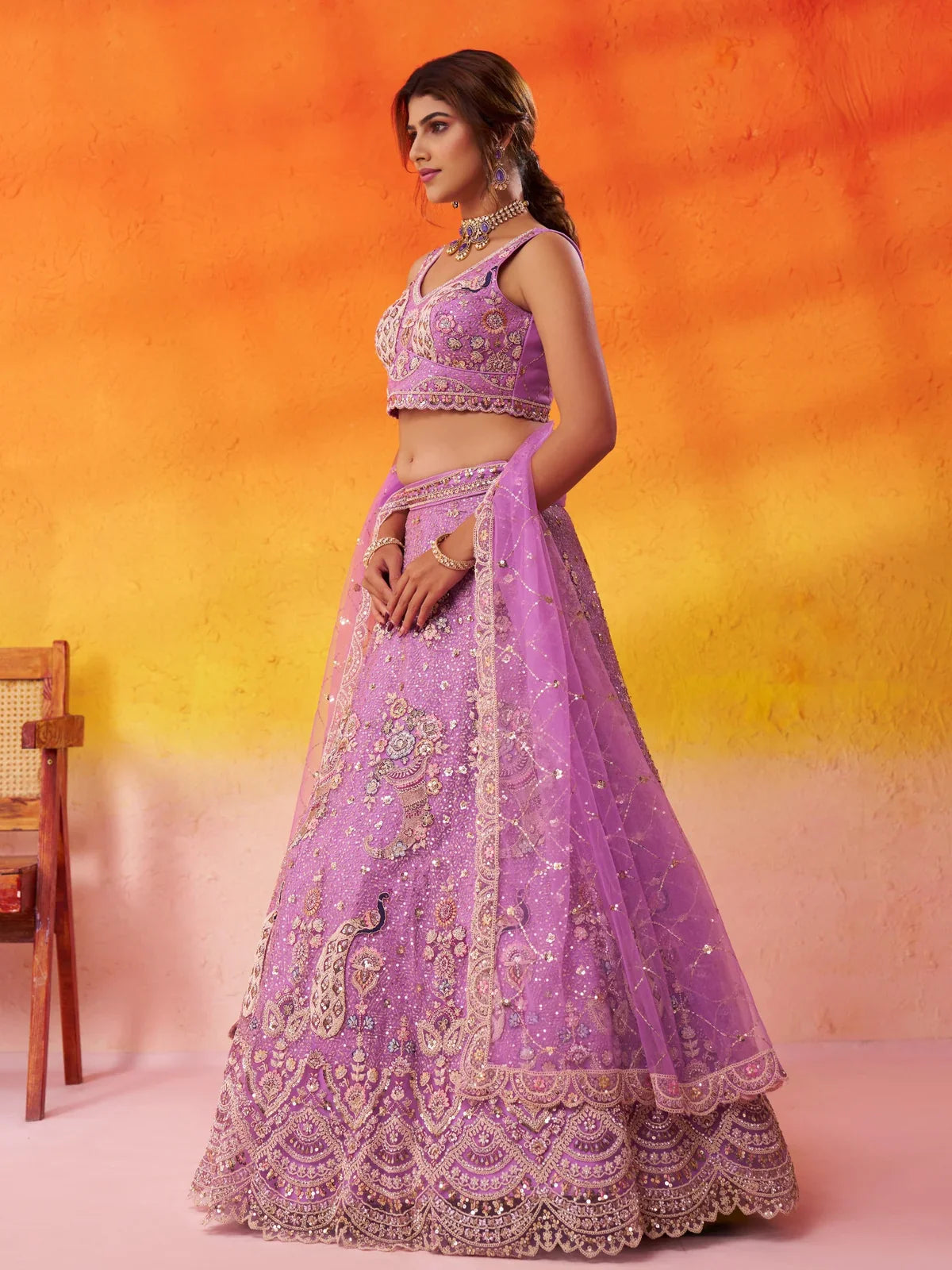 Tarani side view of net lehenga with embroidery and soft sequin work for weddings