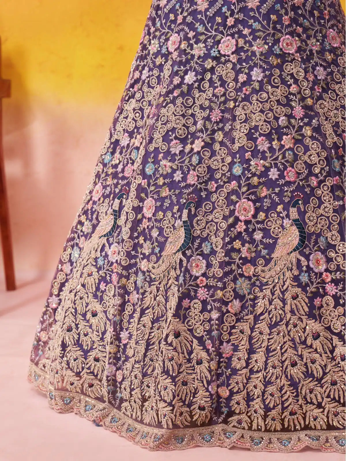 Tarani closeup view highlighting sequin embroidery and thread cutwork on net lehenga