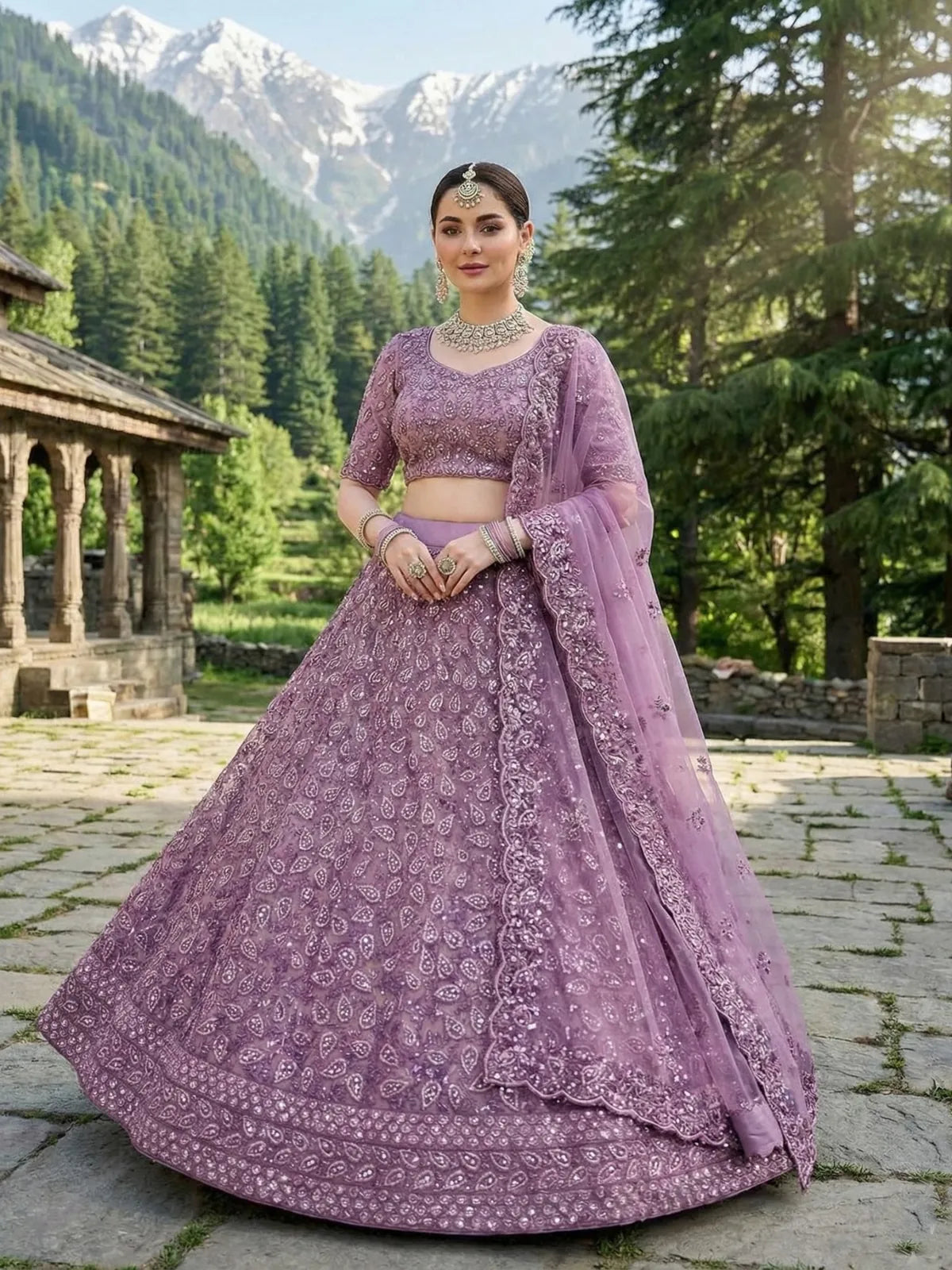Tarani purple bridal net lehenga front pose showing embroidery and flare design