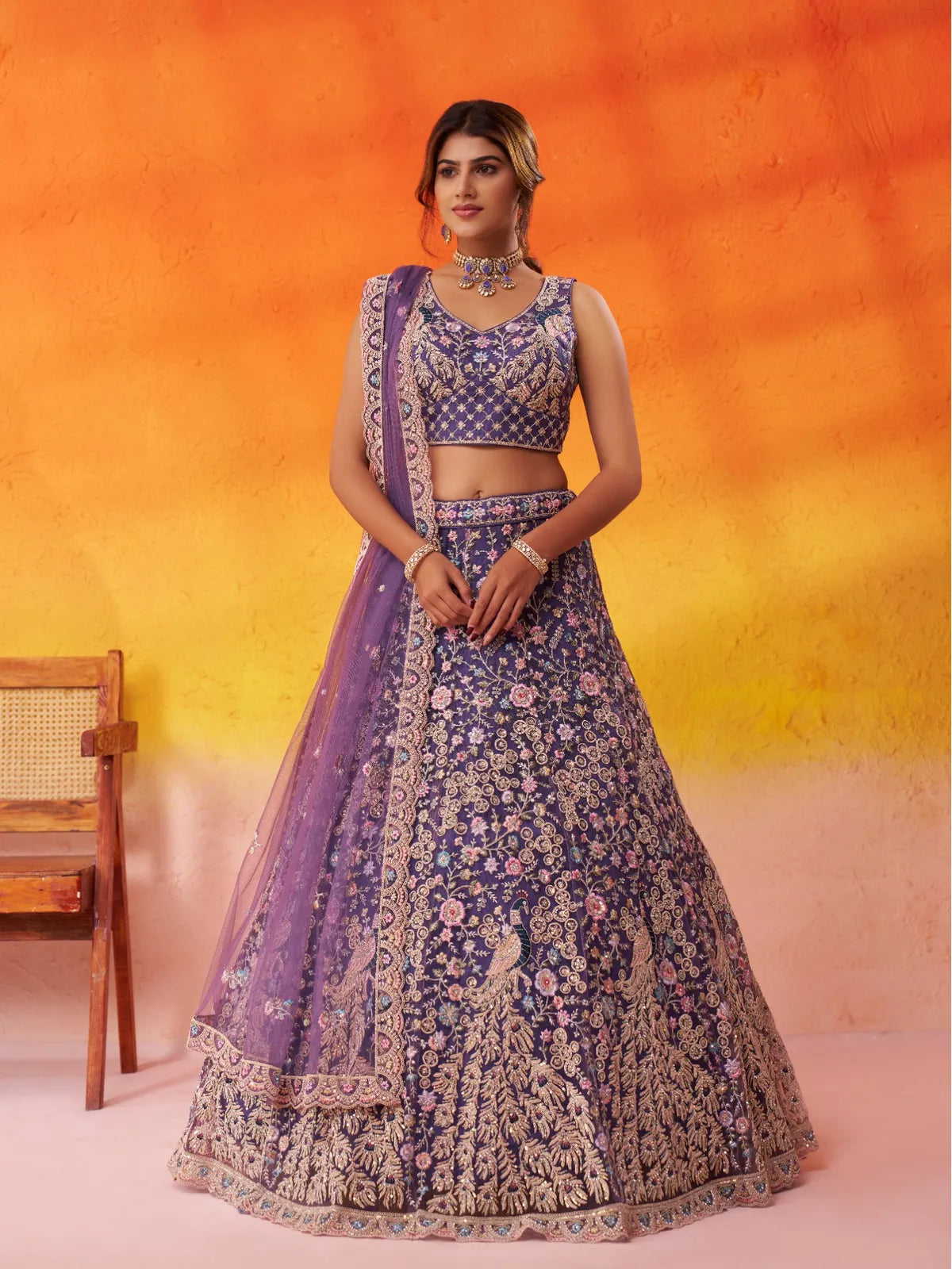 Tarani purple net lehenga full view with embroidery and stone work for festive occasions