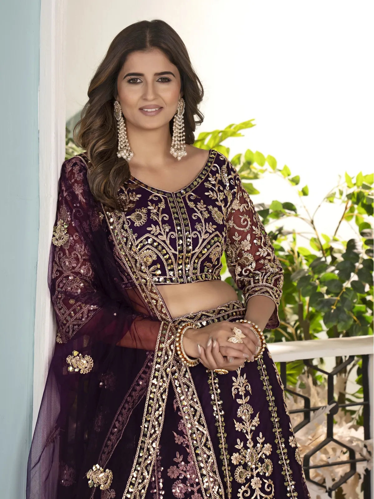 Tarani purple net lehenga upper body view with blouse embroidery details