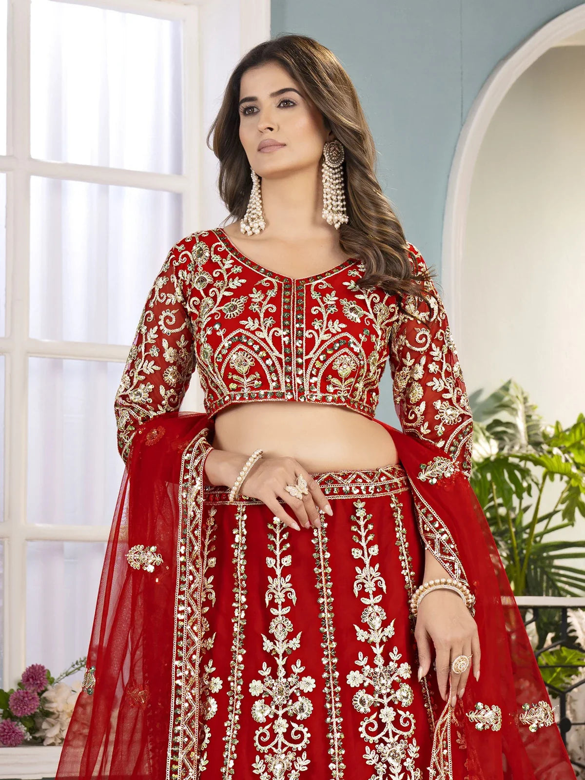 Tarani red net lehenga embroidered blouse and dupatta upper body closeup