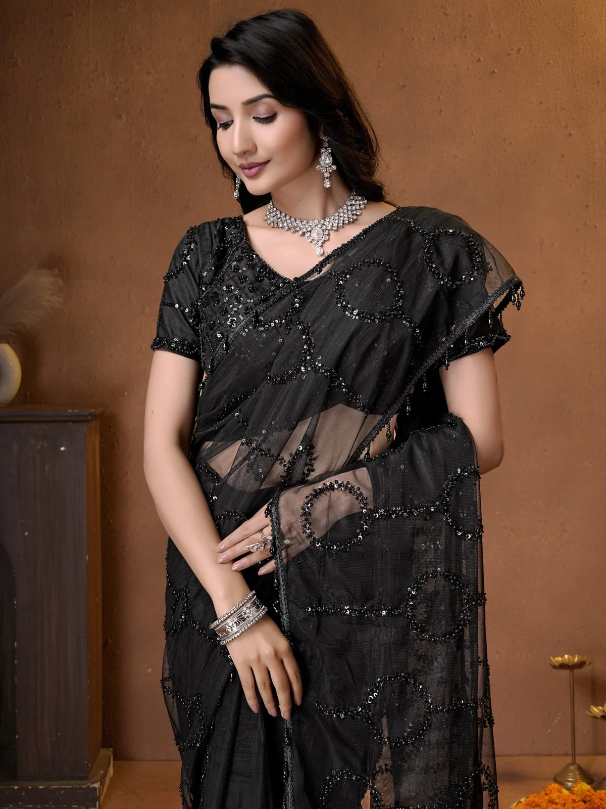 Tarani black designer net saree front view with embroidered pallu