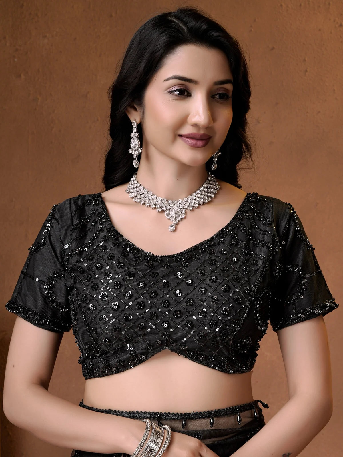 Tarani embroidered black net blouse upper body view with pearl work