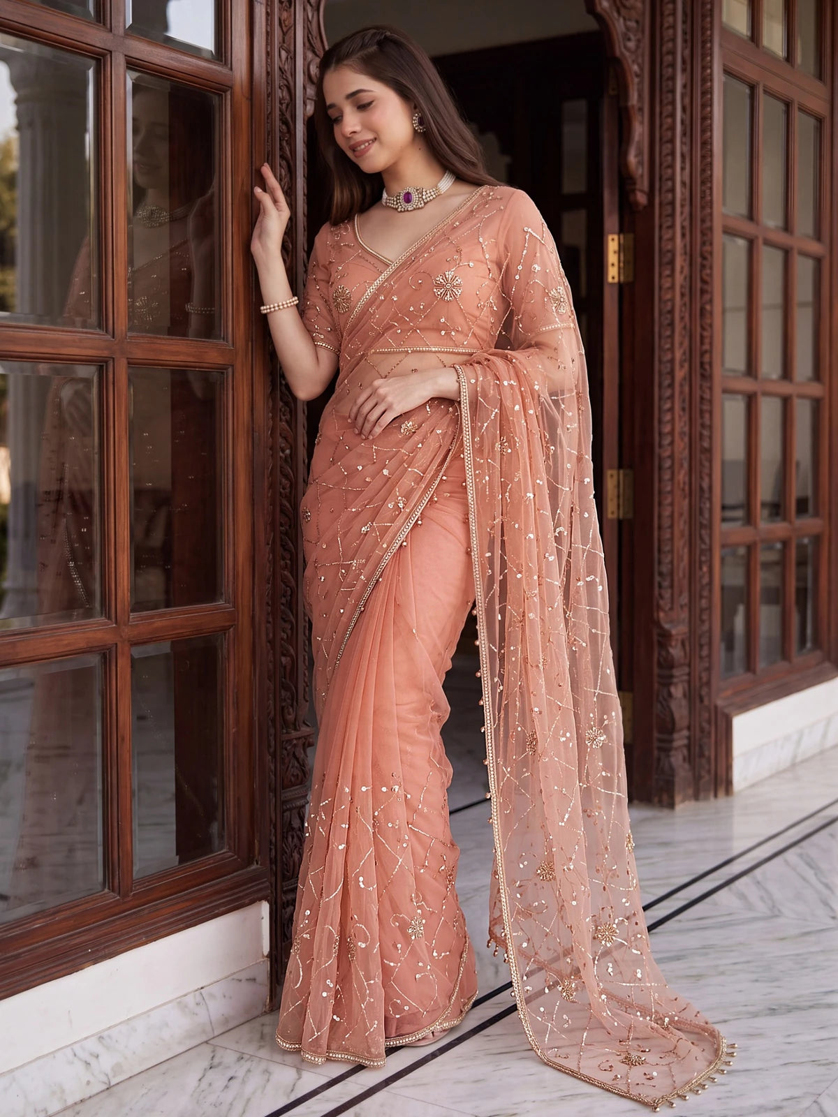 Tarani peach net embroidered saree with beads sequins pearls side view