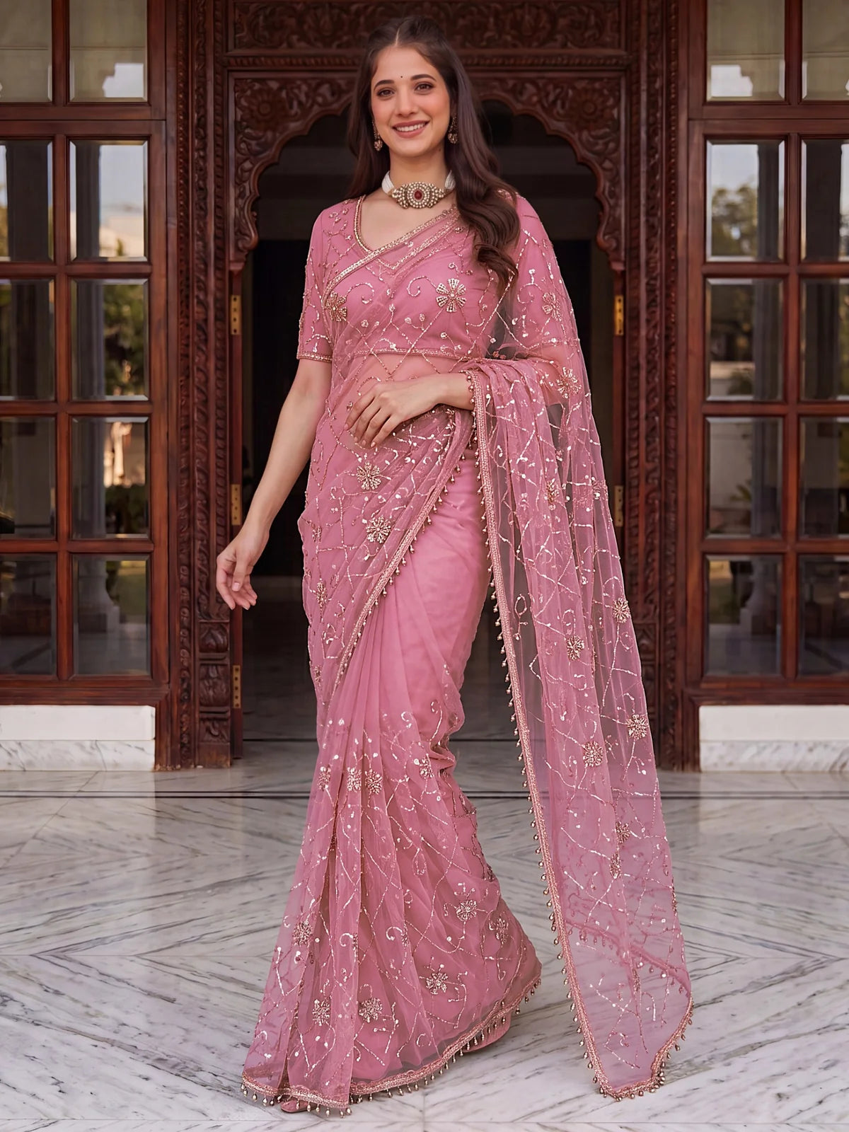 Tarani pink net saree with beads sequins and pearl embroidery front-view