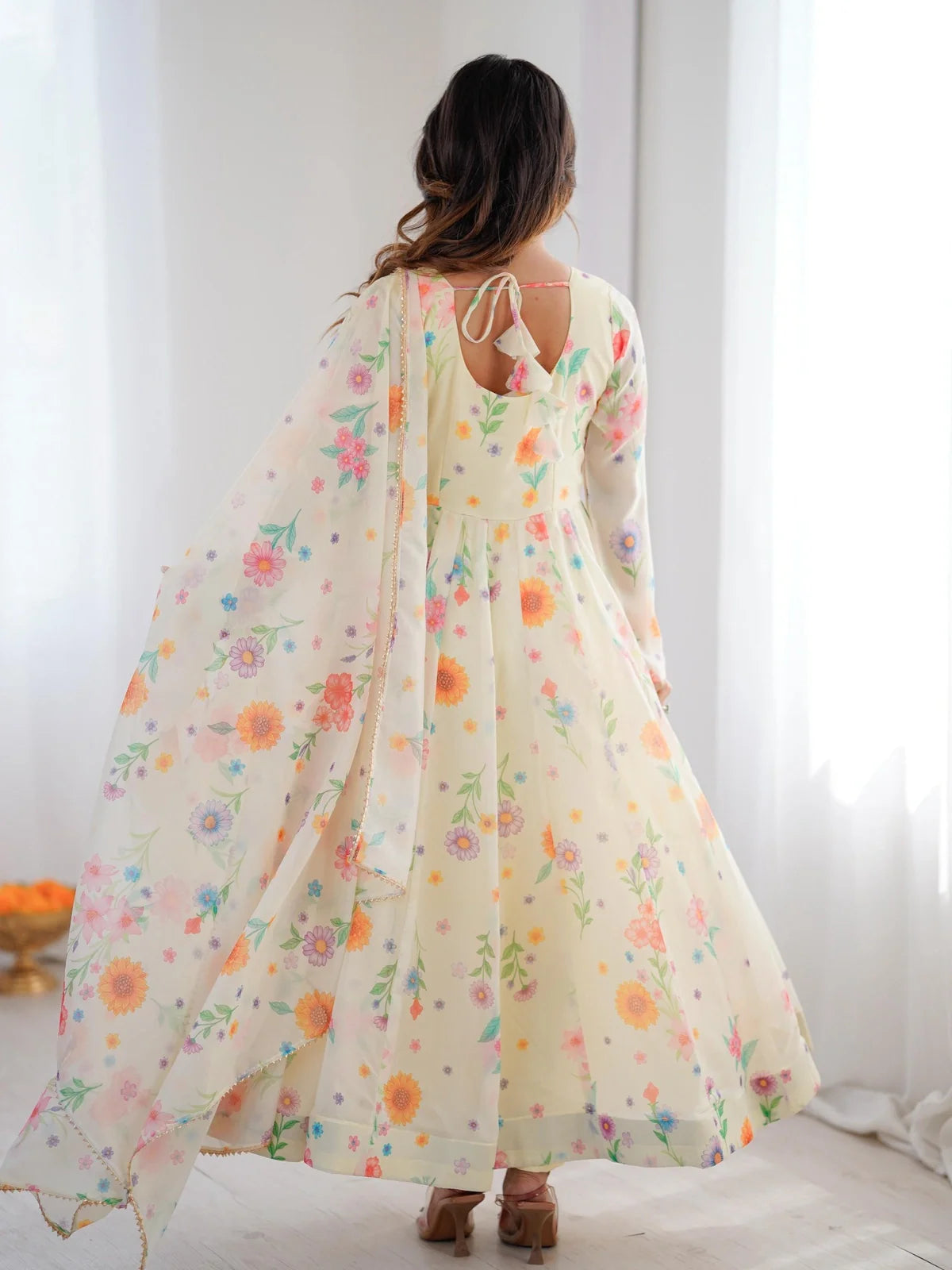 Tarani organza yellow gown back view with keyhole tie design and flowing dupatta