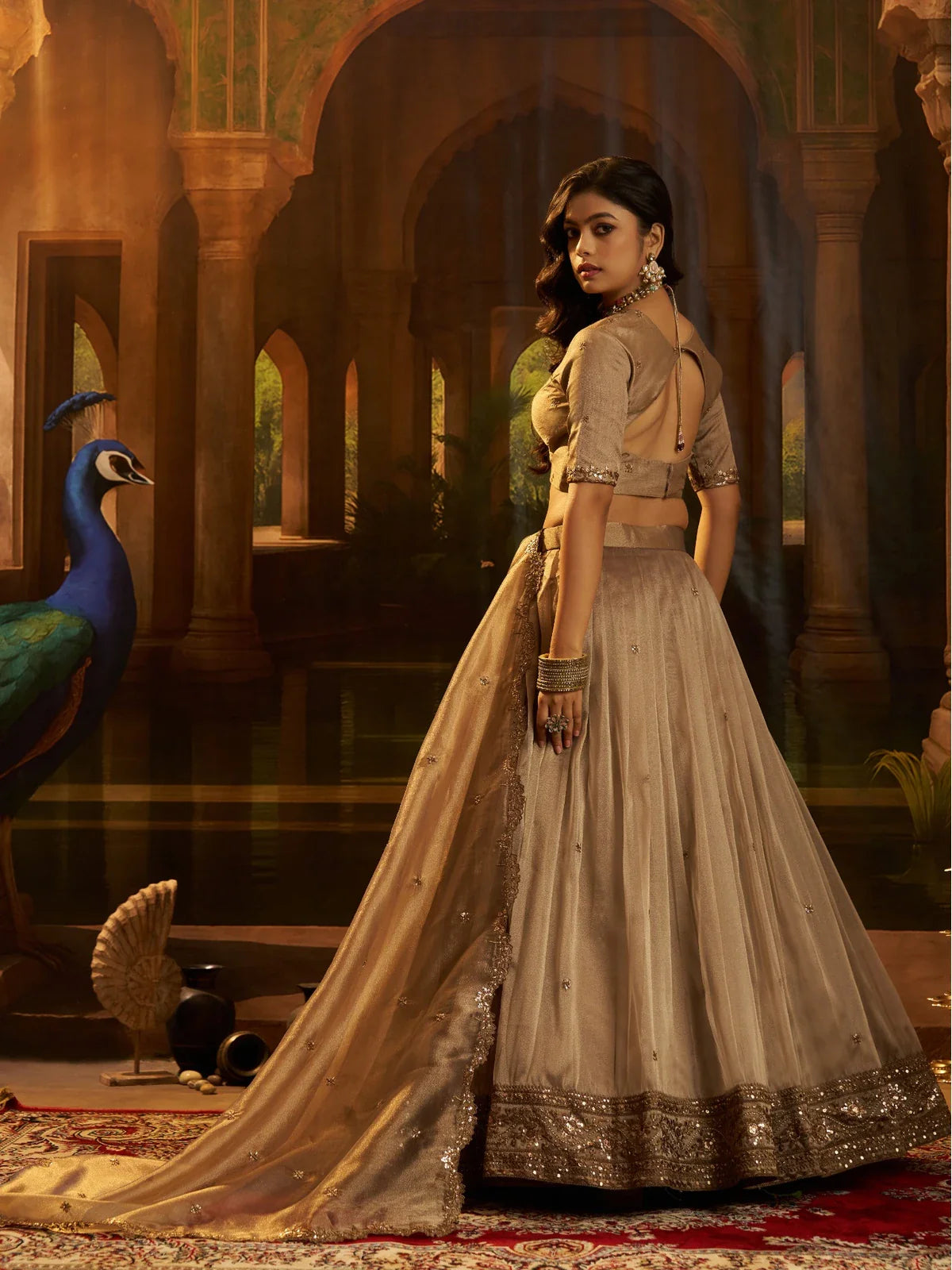 Tarani golden organza lehenga back view with blouse tie-up and detailed dupatta