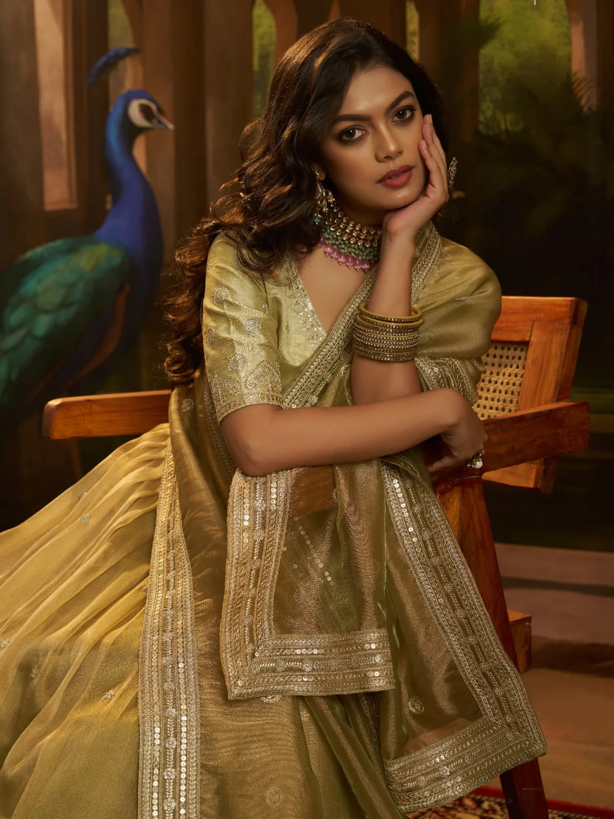 Tarani golden lehenga upper-body shot with detailed neckline and Banglori silk blouse work