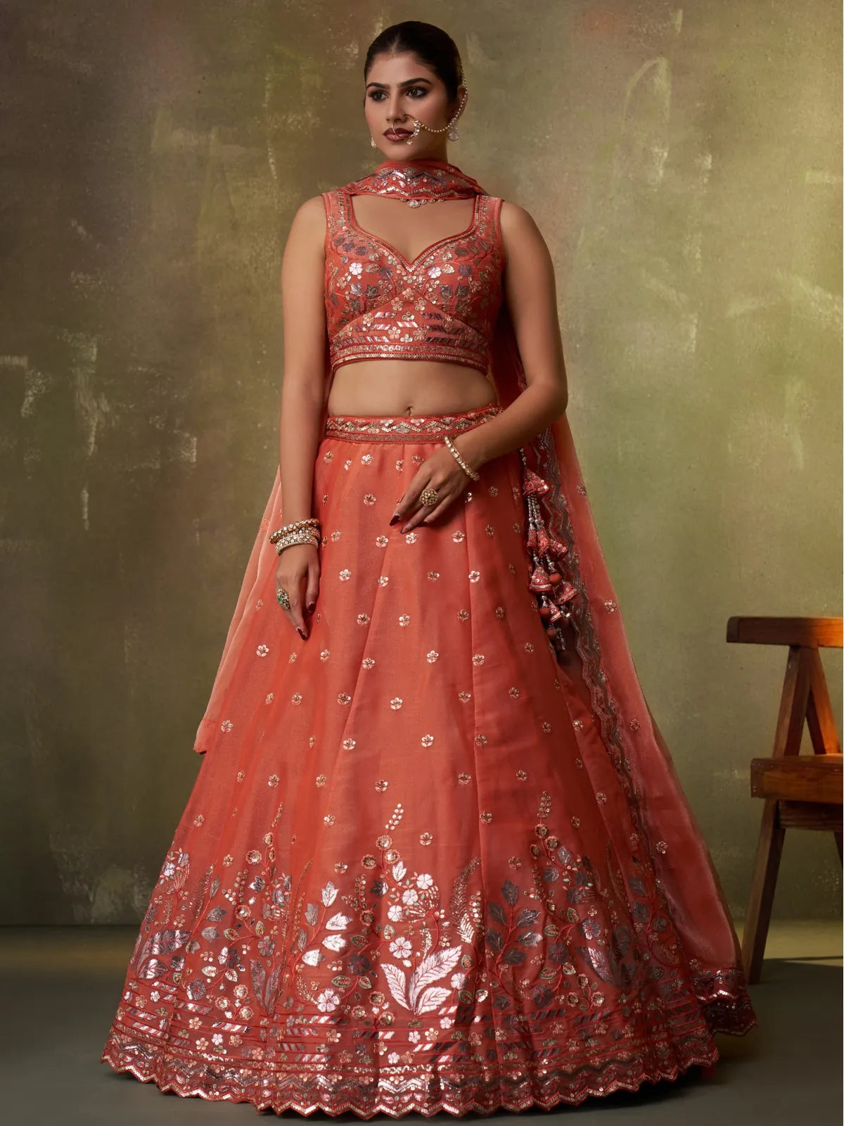 Tarani orange organza lehenga with full flare and detailed embroidery work, ideal for weddings and festive occasions