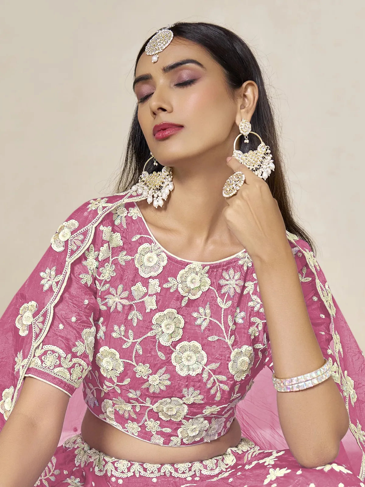 Tarani pink organza silk lehenga upper body view showing blouse embroidery and jewellery