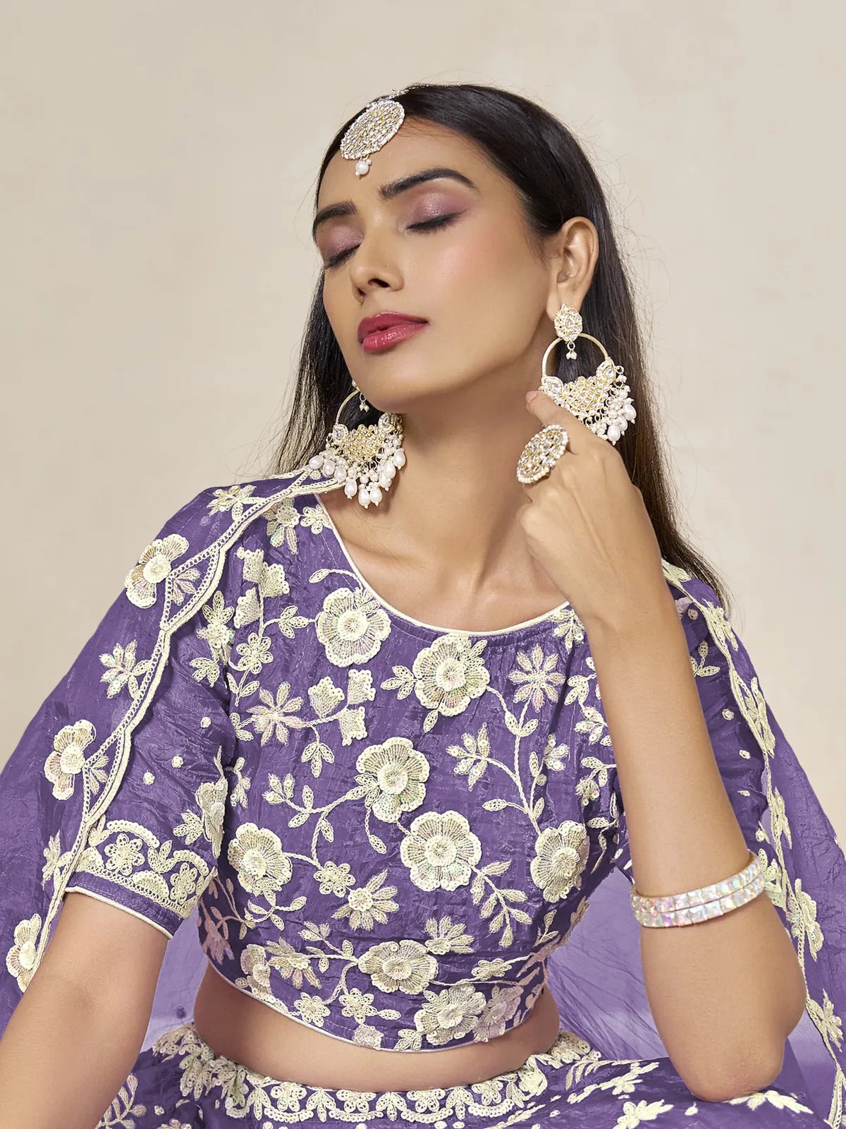 Tarani purple organza lehenga upper body view showing blouse embroidery