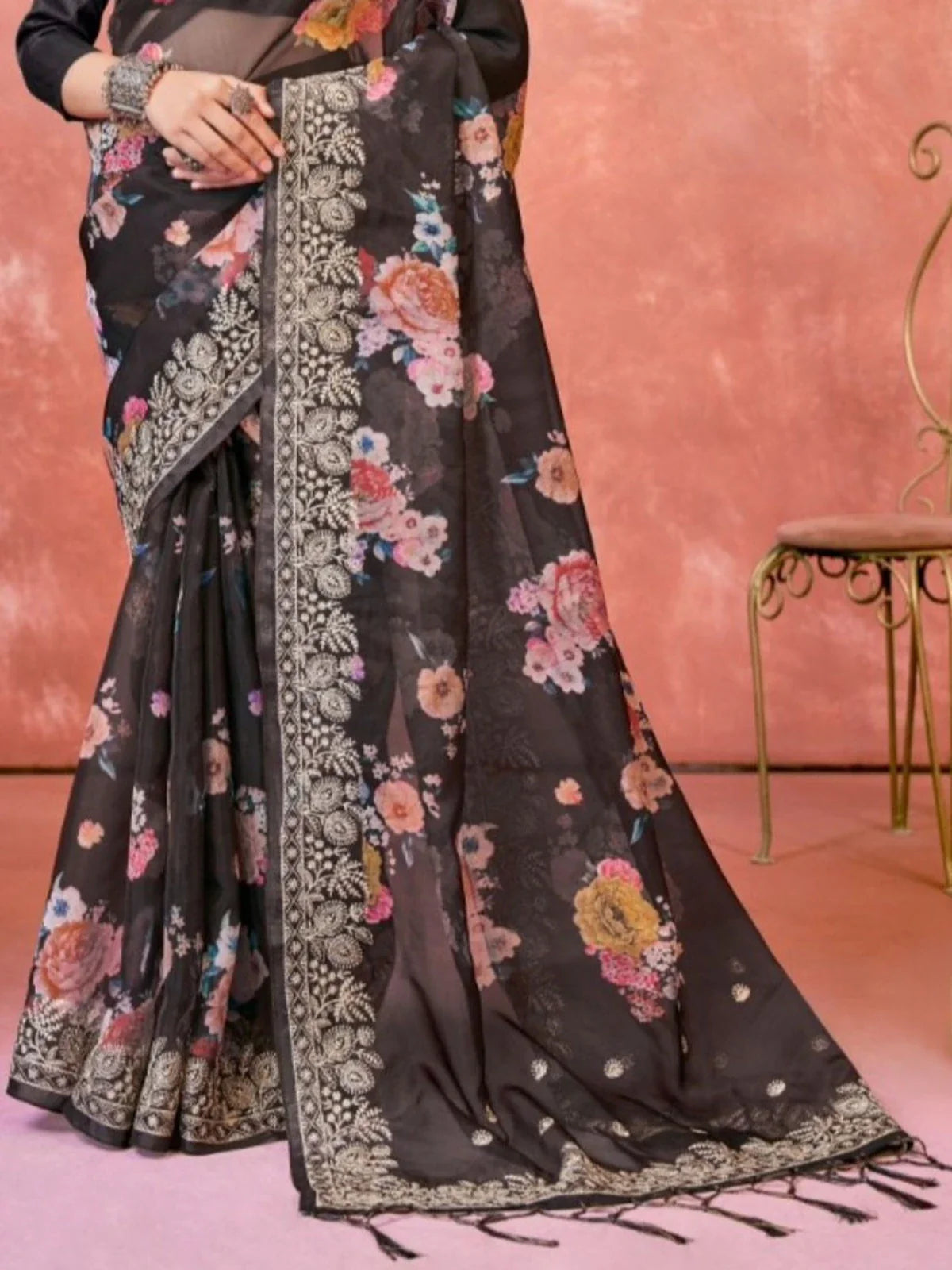 Tarani graceful black organza saree pallu view with floral design and tassel detailing