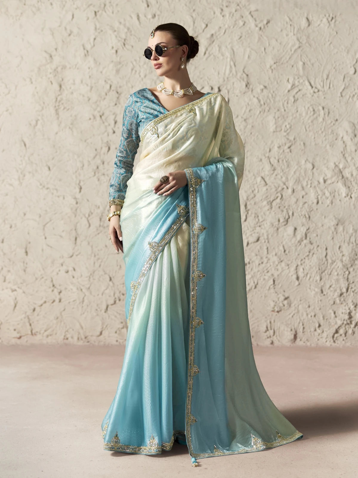 Tarani blue organza saree full view with embroidered border and designer blouse for festive party wear