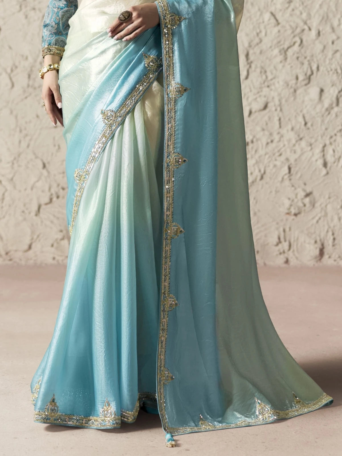 Tarani blue organza saree pallu view with sequins embroidery lace border and elegant detailing