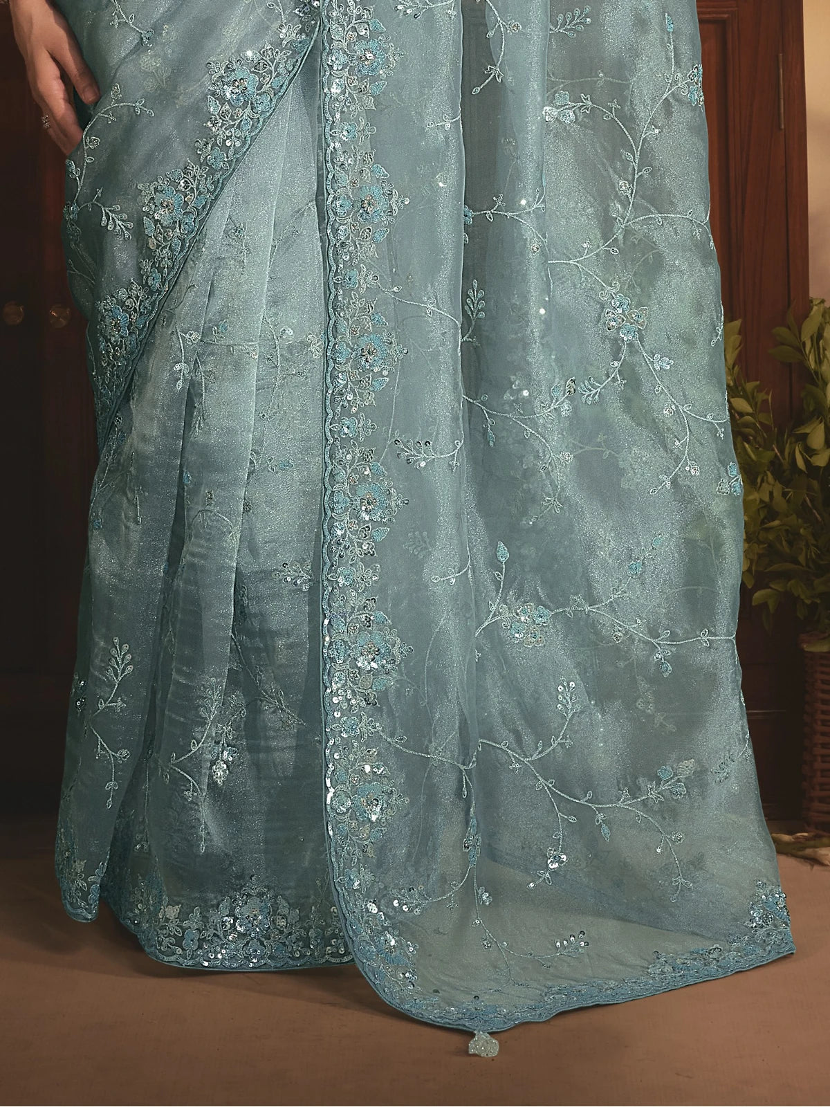 Tarani blue organza saree with detailed embroidery stone border and pallu close view