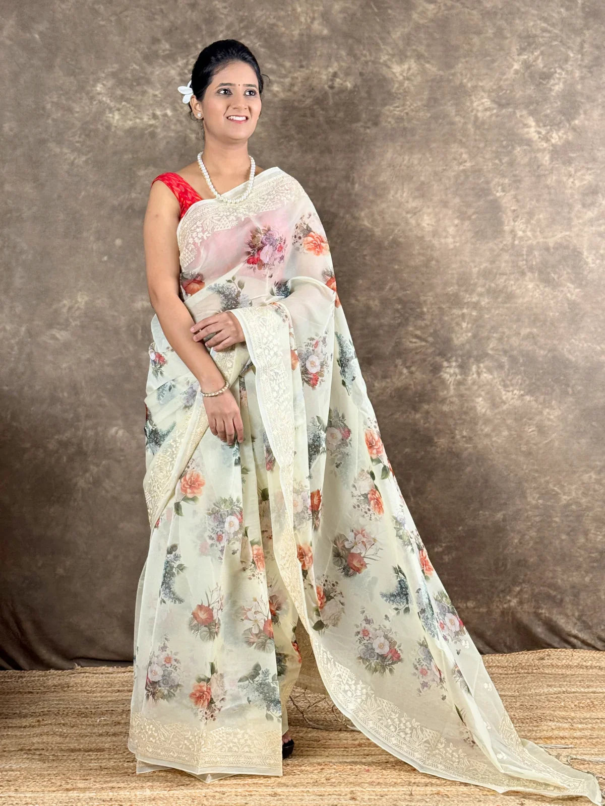 Tarani offwhite silk saree front view with floral motifs and elegant drape