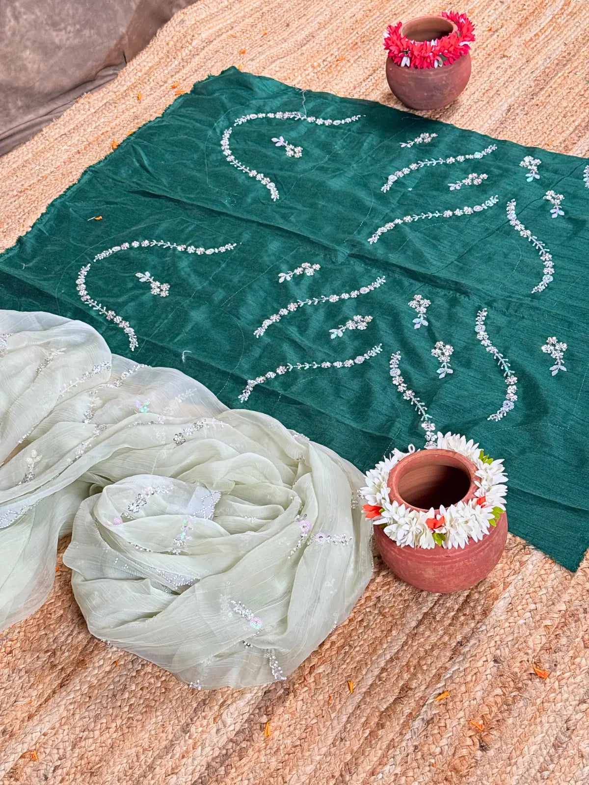 Tarani closeup view of green silk saree fabric with delicate woven work and shimmer