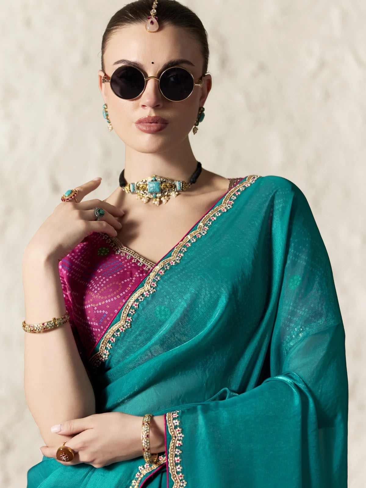 Tarani teal organza saree upper body view with sequins blouse and embroidered lace border